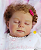 Boneca Bebê Reborn Menina Heather 55 Cm Olhos Fechados Um Verdadeiro Presente Com Enxoval - Imagem 1