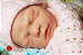 Boneca Bebê Reborn Menina Caroline 46 Cm Olhos Abertos Super Realista Acompanha Placa de Barriga - Imagem 1