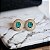 BRINCO OVAL LUXO COM PEDRA CENTRAL TURMALINA BANHADO A OURO - Imagem 3