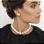 BRINCO EAR CUFF COM TRÊS PÉROLAS SHELL BANHADO A OURO - Imagem 2