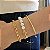 PULSEIRA COM ELOS LISOS E PÉROLAS SHELL BANHADA A OURO - Imagem 2