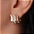 Brinco Banhado Ouro 18k Ear Rock com Zirconias com três Faixas Curvadas sendo  Duas Lisas e uma Cravejada - Imagem 2