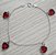 PULSEIRA DE PRATA COM PENDURICALHOS VERMELHO LOVE - Imagem 1