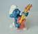 Miniatura de vinil Schleich de smurf roqueiiro 5cm guitarra vermelha Peyo 1978 - Imagem 1
