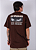 Camiseta Chronic - O Mundo é Cruel Mas Nóis é Cria - Marrom - Imagem 1