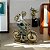 ESCULTURA MULHER NA BICICLETA DECOR RESINA DOUR E VERDE 22CM - Imagem 2