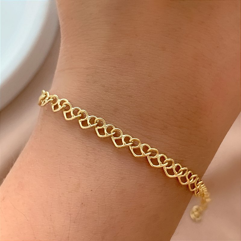 PULSEIRA ELOS CORAÇÕES DESENHADOS FOLHEADO A OURO 18K⭐️