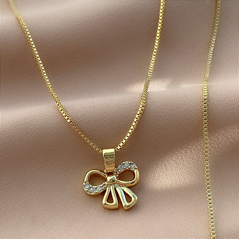 COLAR LAÇO ZIRCÔNIAS BOLEADO FOLHEADO A OURO 18K⭐️