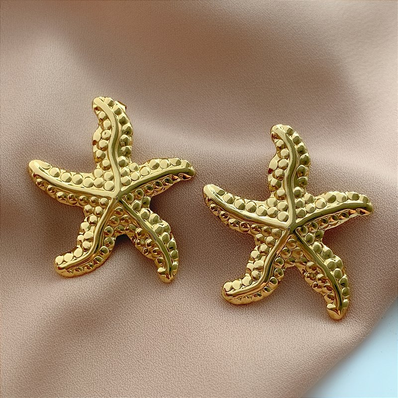 BRINCO ESTRELA DO MAR TEXTURIZADA DOURADO AÇO 316L⭐️