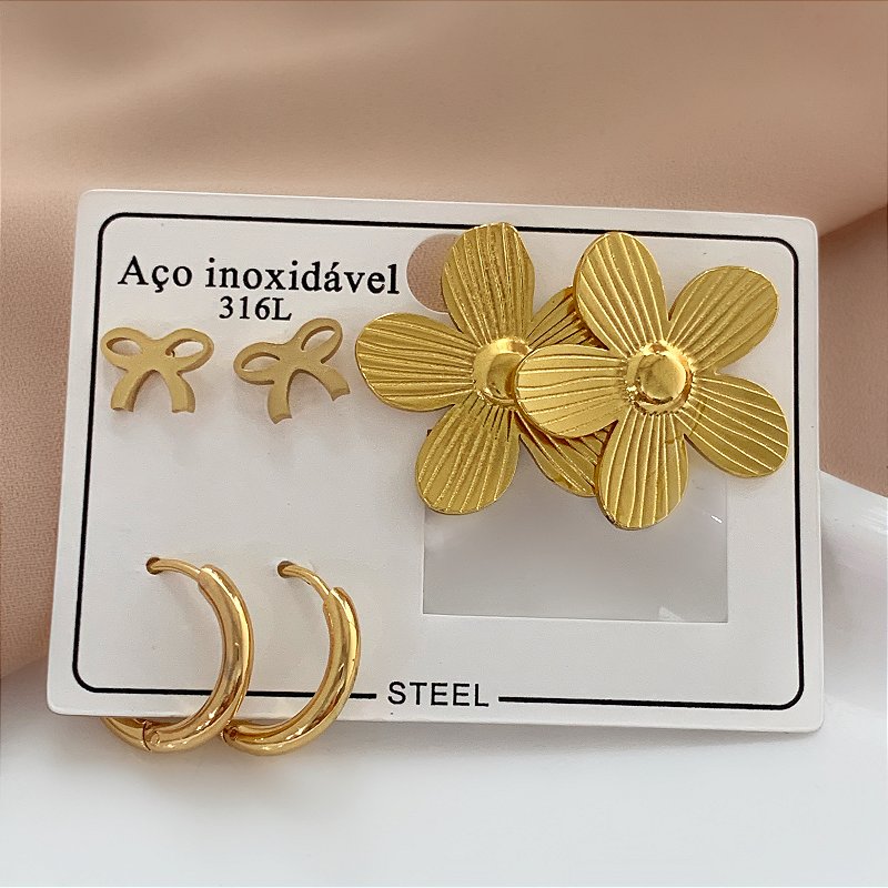 BRINCO KIT FLOR E LAÇO DOURADO AÇO 316L⭐️