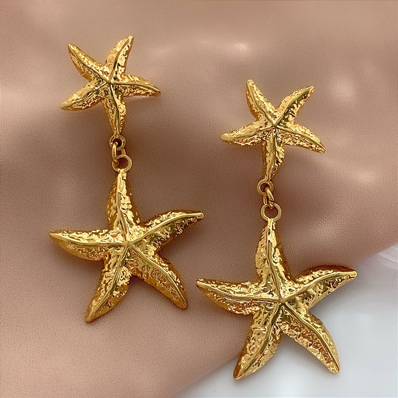 BRINCO ESTRELAS PENDENTES DOURADO AÇO 316L ⭐️