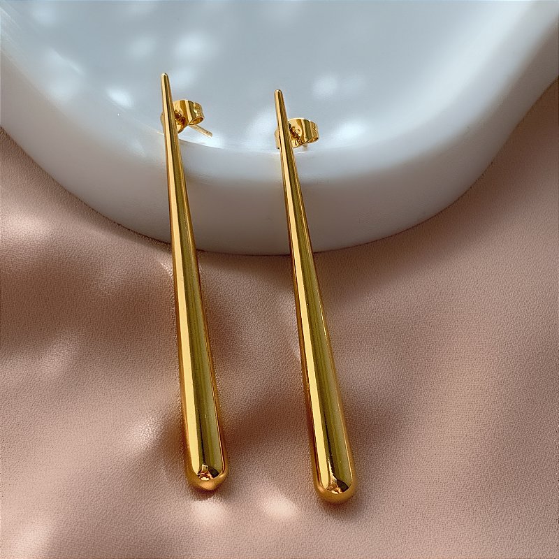 BRINCO GOTA FINA ALONGADA DOURADO AÇO 316L⭐️