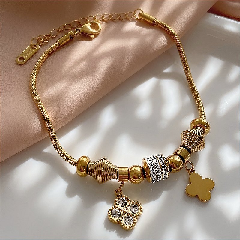 PULSEIRA PINGENTES TREVOS E ZIRCÔNIAS DOURADO AÇO 316L⭐️
