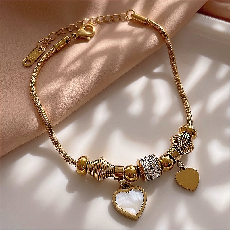 PULSEIRA PINGENTES CORAÇÃO MADREPÉROLA E ZIRCÔNIAS DOURADO AÇO 316L⭐️